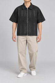 Front view of Quiet Shift Zip Denim Shirt in Black, showing the plain washed denim, full metal zip and wide short sleeves.