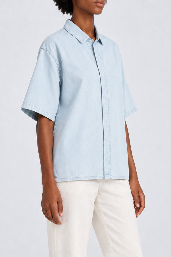 Three-quarter view of Soft Current Lyocell Shirt in Light Blue, showing the wide short sleeves and plain relaxed shape.