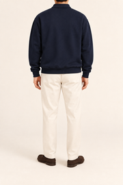 Quiet Club Polo Sweatshirt in Dark Blue. Rear view showing the plain back and ribbed hem.