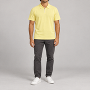 Clean Interval Zip Polo in Light Yellow. Front view showing the plain yellow body and pale quarter zip.
