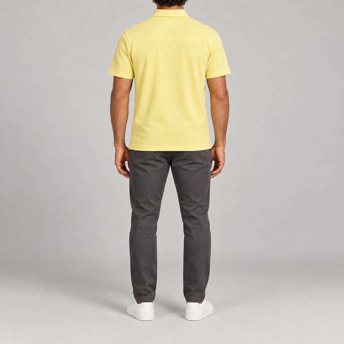 Clean Interval Zip Polo in Light Yellow. Rear view showing the upper back yoke and short sleeves.