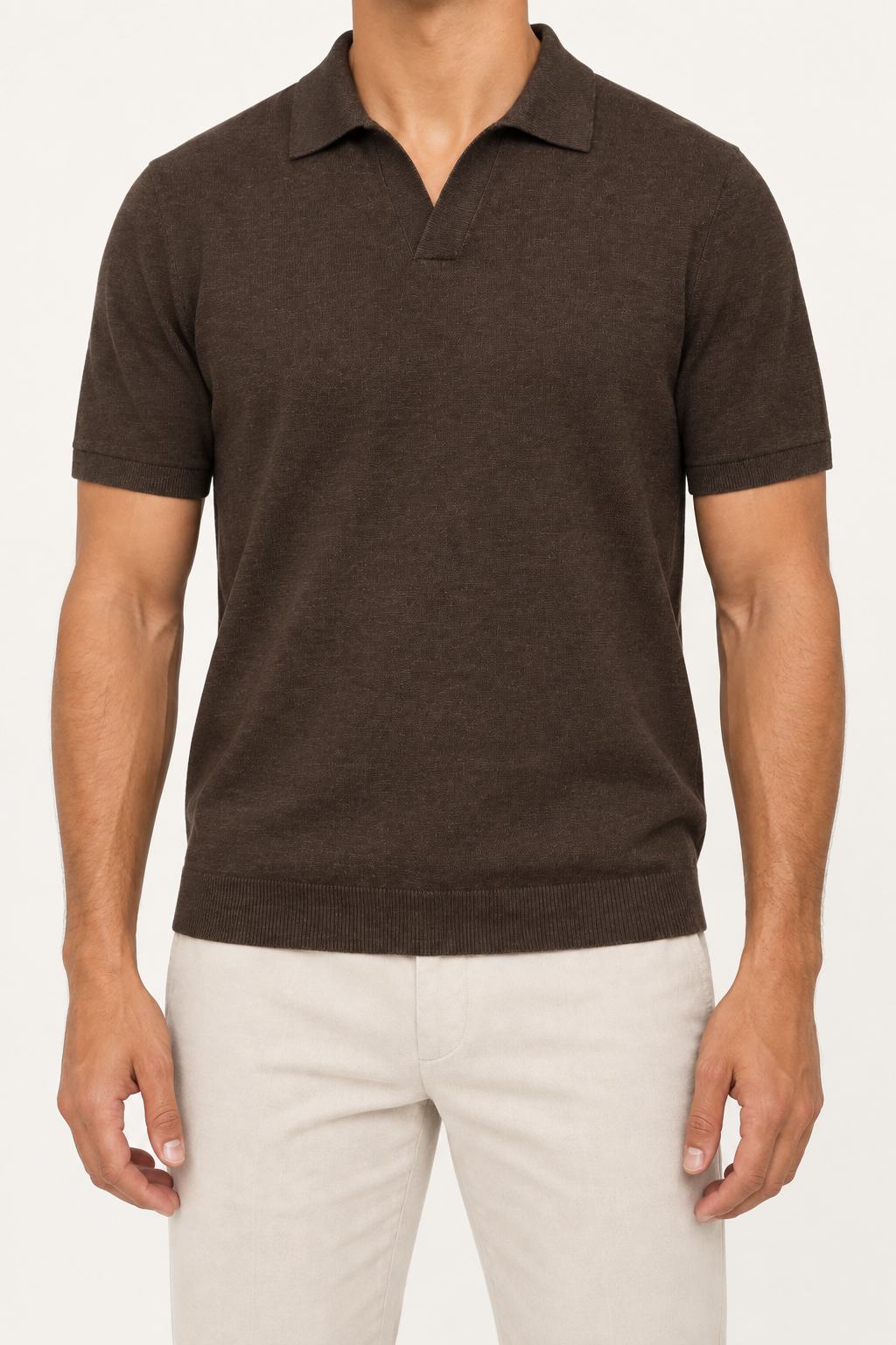 Front studio view showing the plain knit, open collar and ribbed hem of Still Hour Knit Polo in Dark Brown.