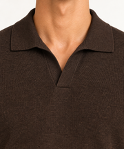 Close-up studio view showing the fine knit and buttonless collar of Still Hour Knit Polo in Dark Brown.