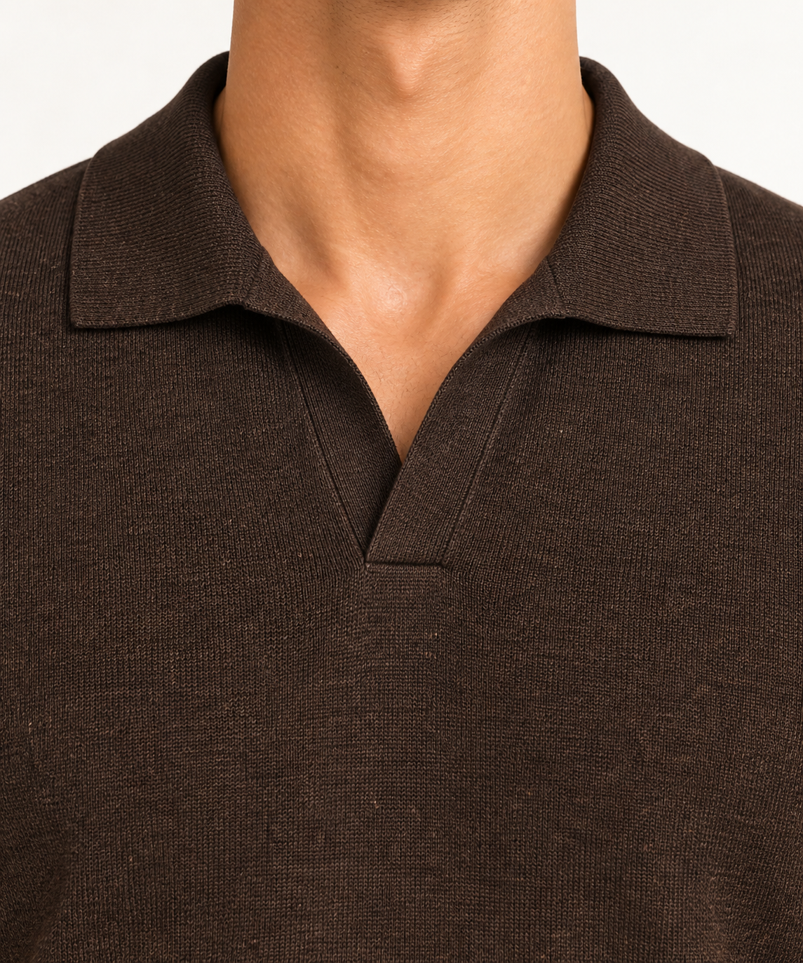 Close-up studio view showing the fine knit and buttonless collar of Still Hour Knit Polo in Dark Brown.