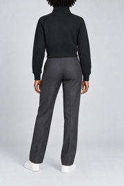 Rear studio view showing the curved yoke and ribbed back hem panel of Curve Interval Half-Zip Sweatshirt in Black.