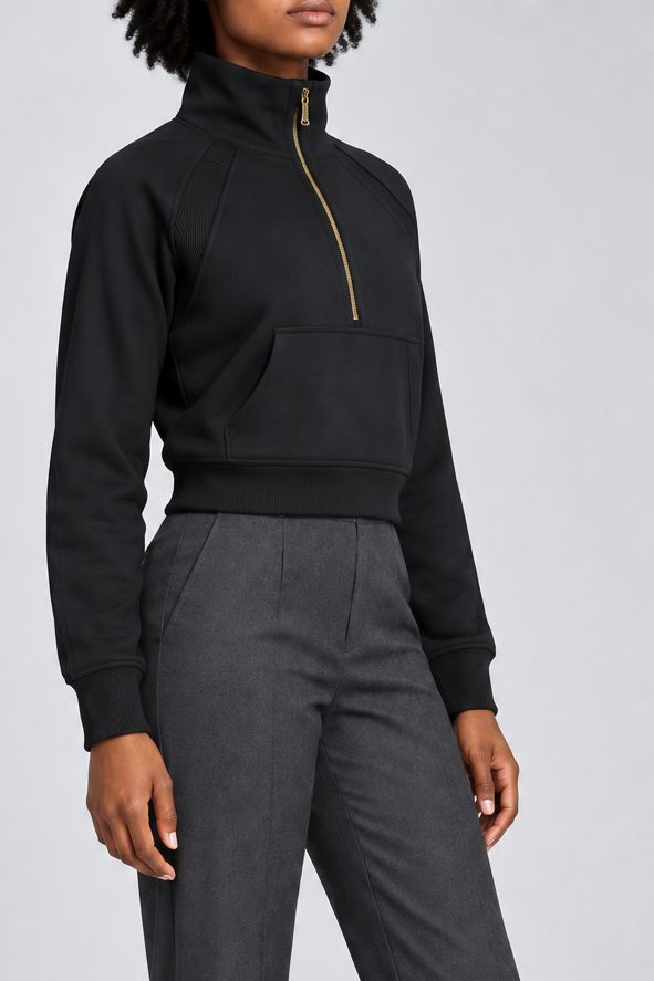 Three-quarter side studio view showing the raglan sleeves and cropped silhouette of Curve Interval Half-Zip Sweatshirt in Black.
