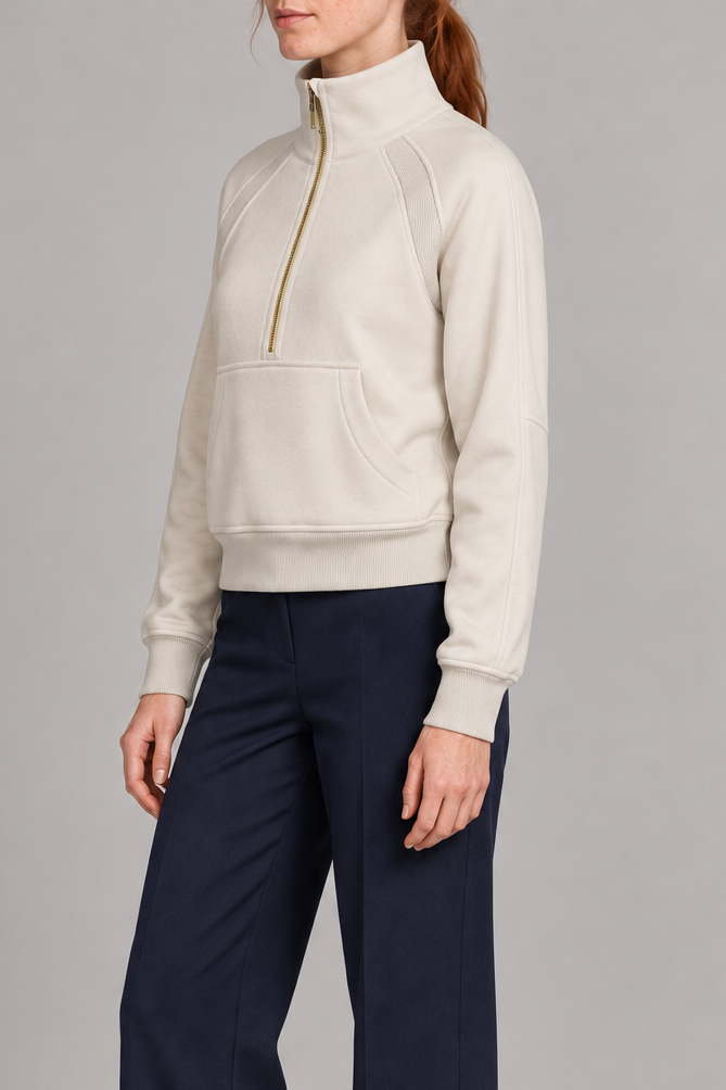 Three-quarter side studio view showing the raglan sleeves and cropped silhouette of Curve Interval Half-Zip Sweatshirt in White.