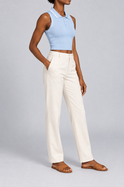 Three-quarter side studio view showing the ribbed texture and bound armholes of Court Line Polo Tank in Blue with White.