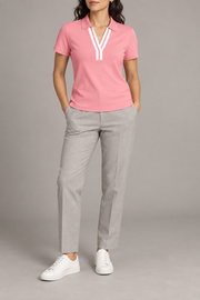 Court Ease V-Neck Polo in Pink. Front studio view showing the white-banded V neckline and slim silhouette.
