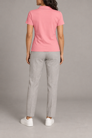 Court Ease V-Neck Polo in Pink. Rear studio view showing the plain pink back and short sleeves.