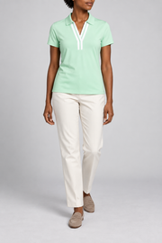 Court Ease V-Neck Polo in Mint Green. Front studio view showing the white-banded neckline and slim mint silhouette.