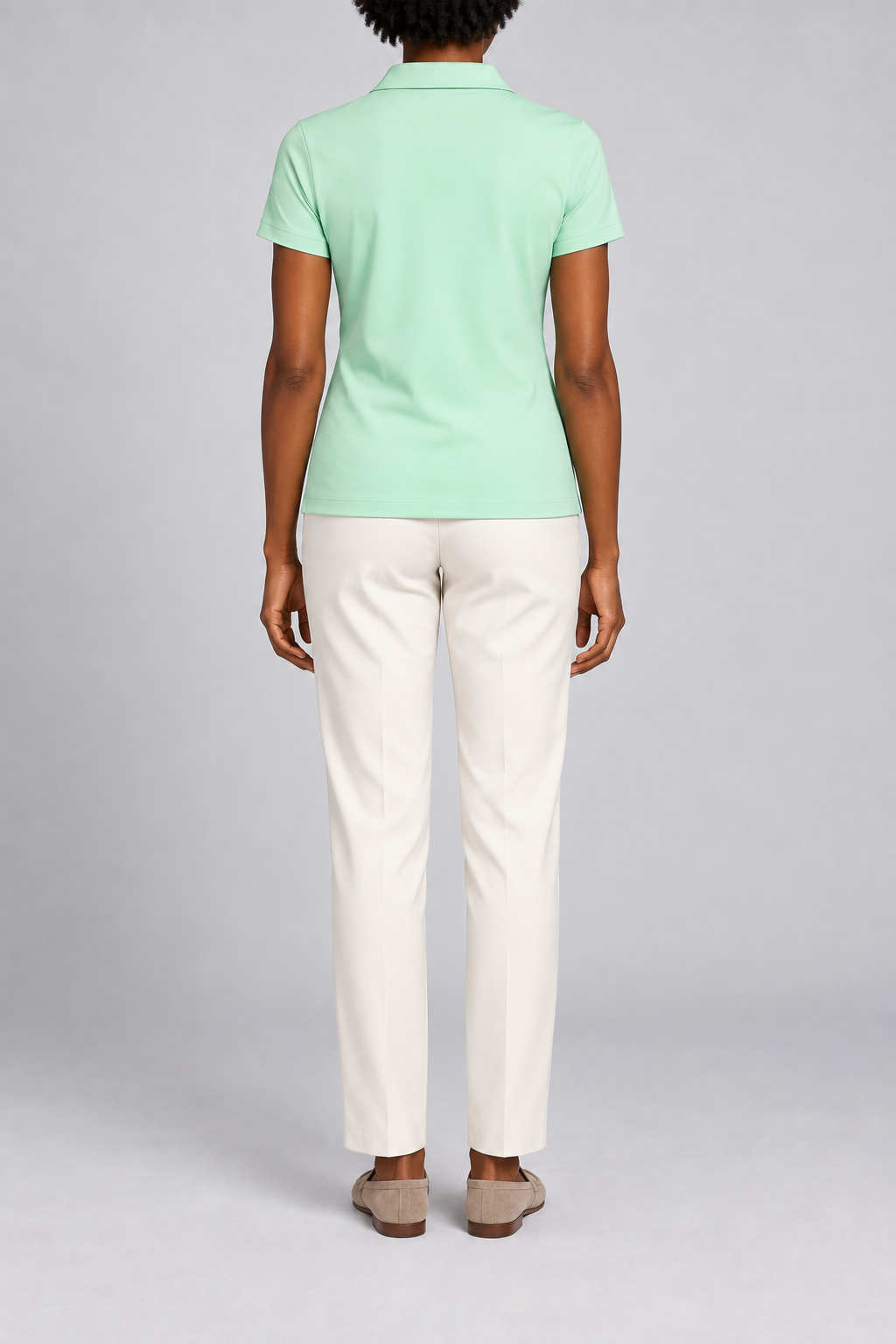 Court Ease V-Neck Polo in Mint Green. Rear studio view showing the plain mint green back and short sleeves.