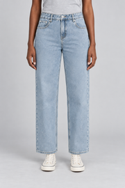 Worn Rhythm Straight Jeans in Blue. Front studio view showing the loose straight legs and pale washed blue denim.