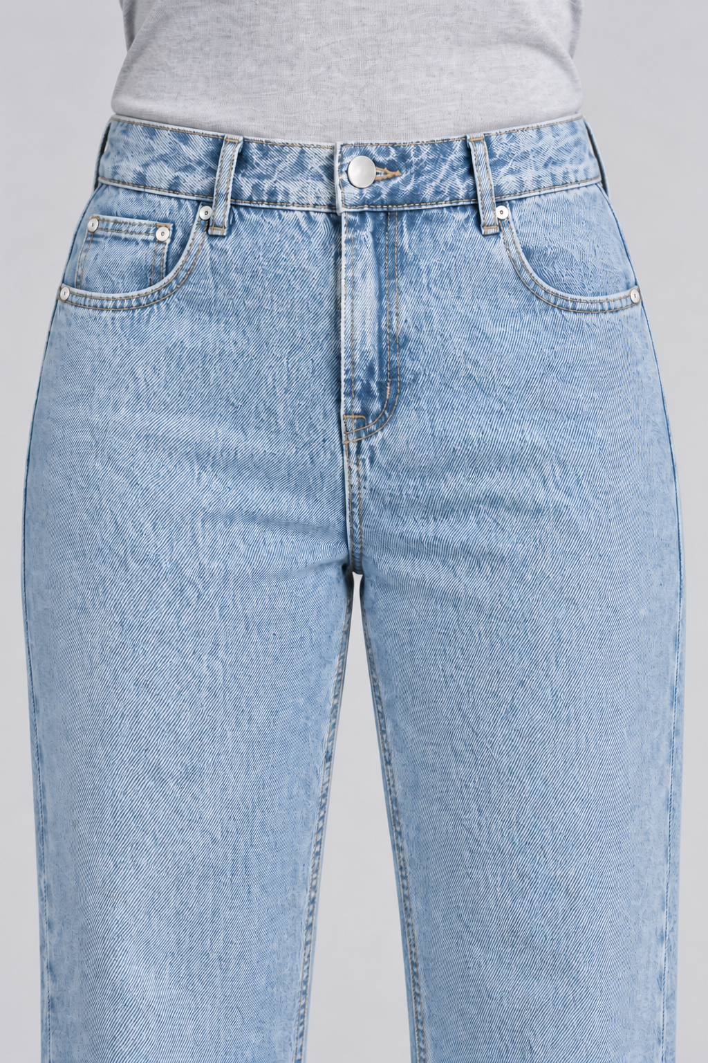 Worn Rhythm Straight Jeans in Blue. Close-up showing the blue denim waistband, coin pocket and silver-tone rivets.