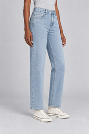 Worn Rhythm Straight Jeans in Blue. Three-quarter studio view showing the straight cut and ankle-length hems.
