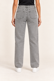 Worn Rhythm Straight Jeans in Light Gray. Rear studio view showing two plain patch pockets and tonal stitching.