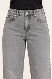 Worn Rhythm Straight Jeans in Light Gray. Close-up showing the light gray denim waistband, coin pocket and silver-tone rivets.