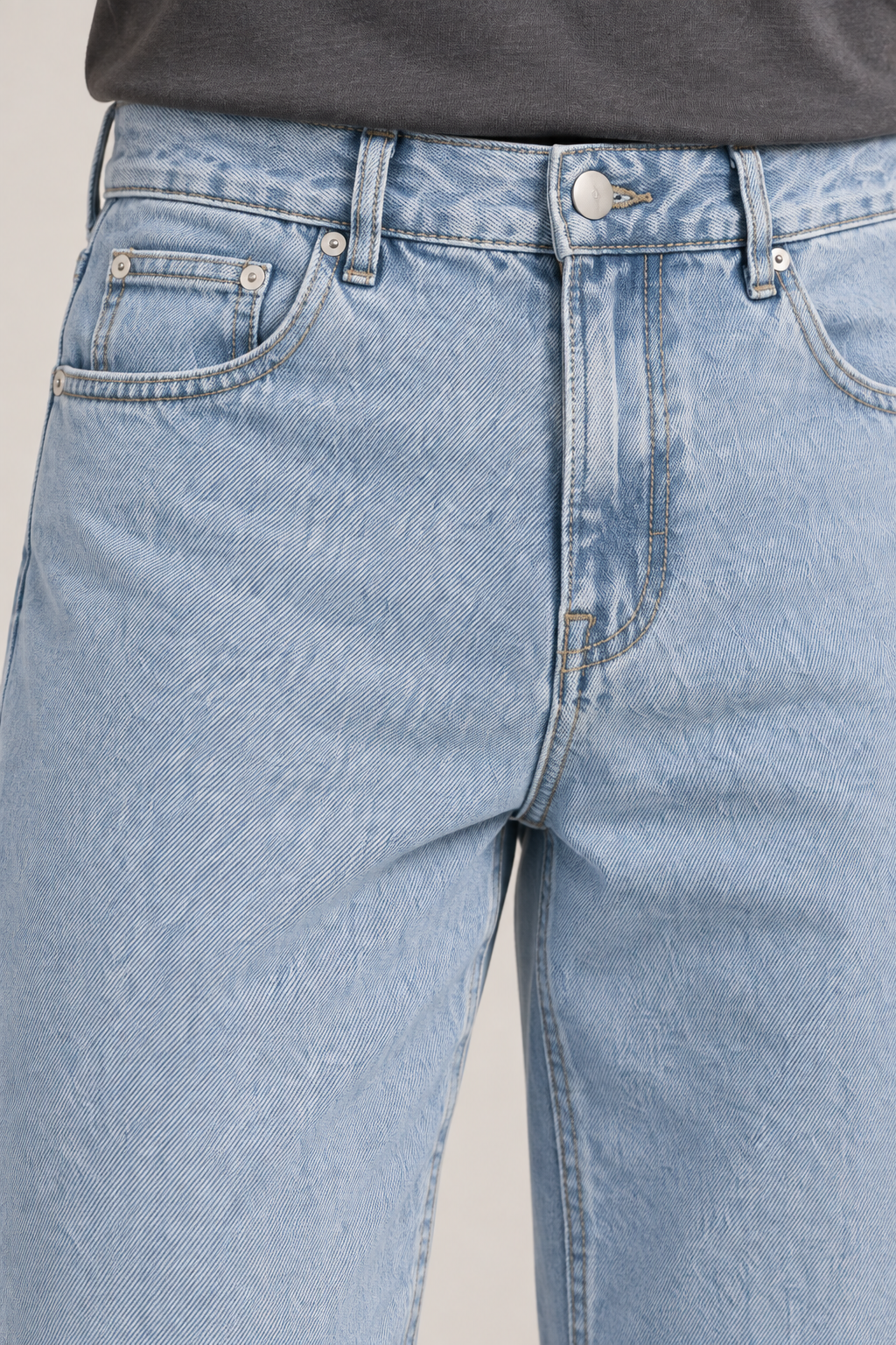 Close-up of Still Rhythm Straight Jeans in Blue, showing the button, belt loops, coin pocket and rivets.