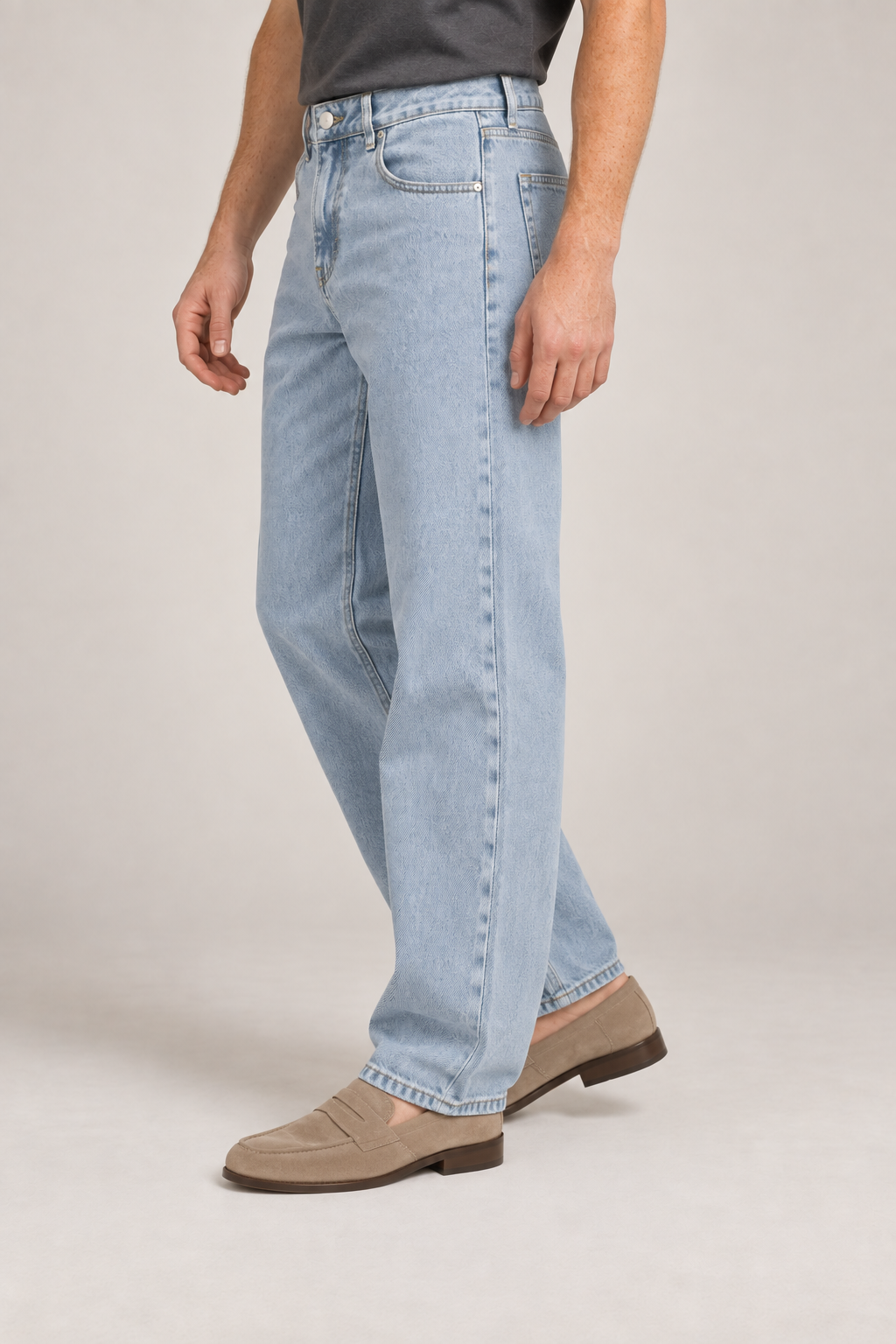 Three-quarter side studio view of Still Rhythm Straight Jeans in Blue, showing the straight silhouette and washed finish.