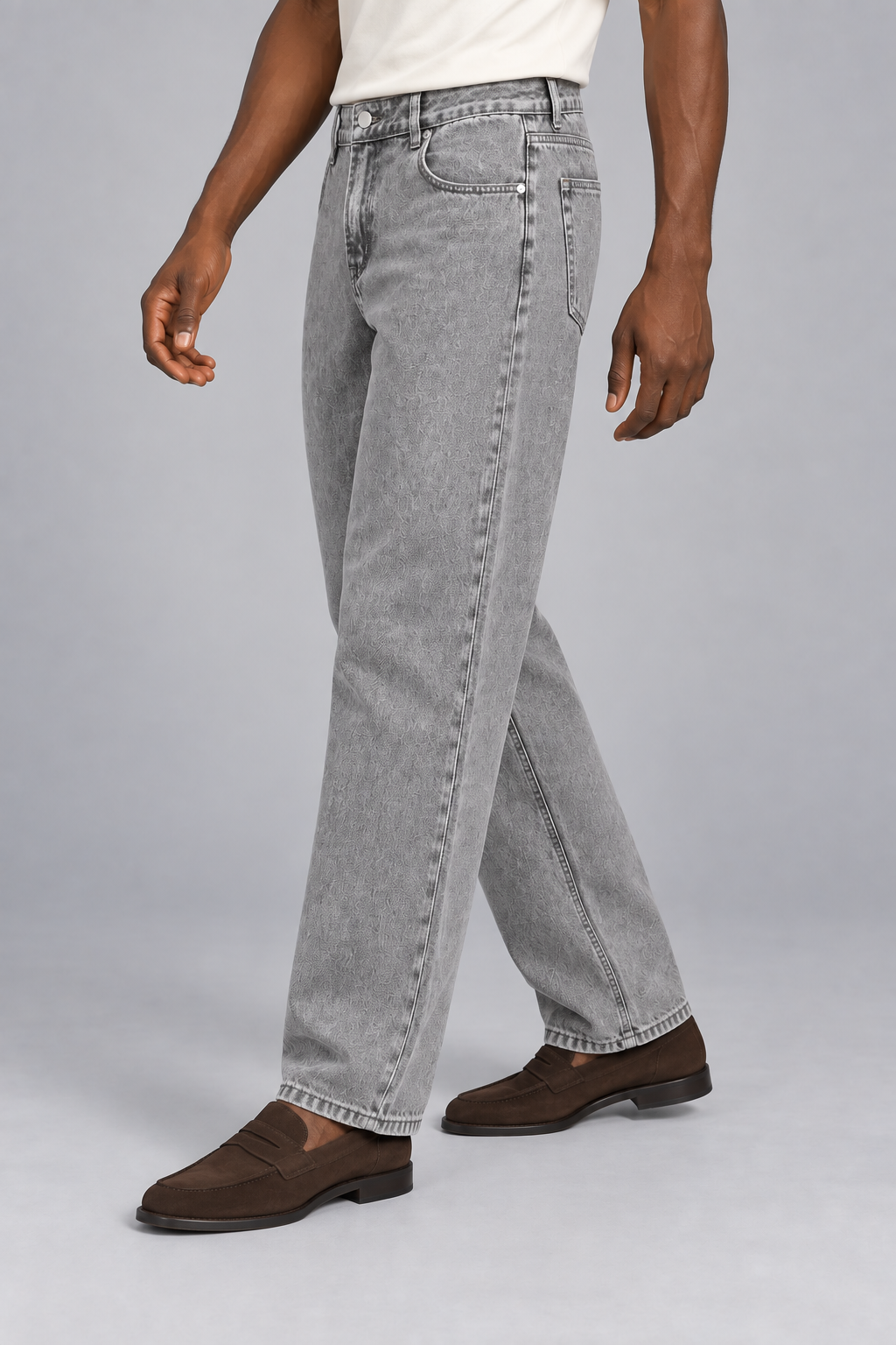 Three-quarter side studio view of Still Rhythm Straight Jeans in Light Gray, showing the loose straight silhouette.