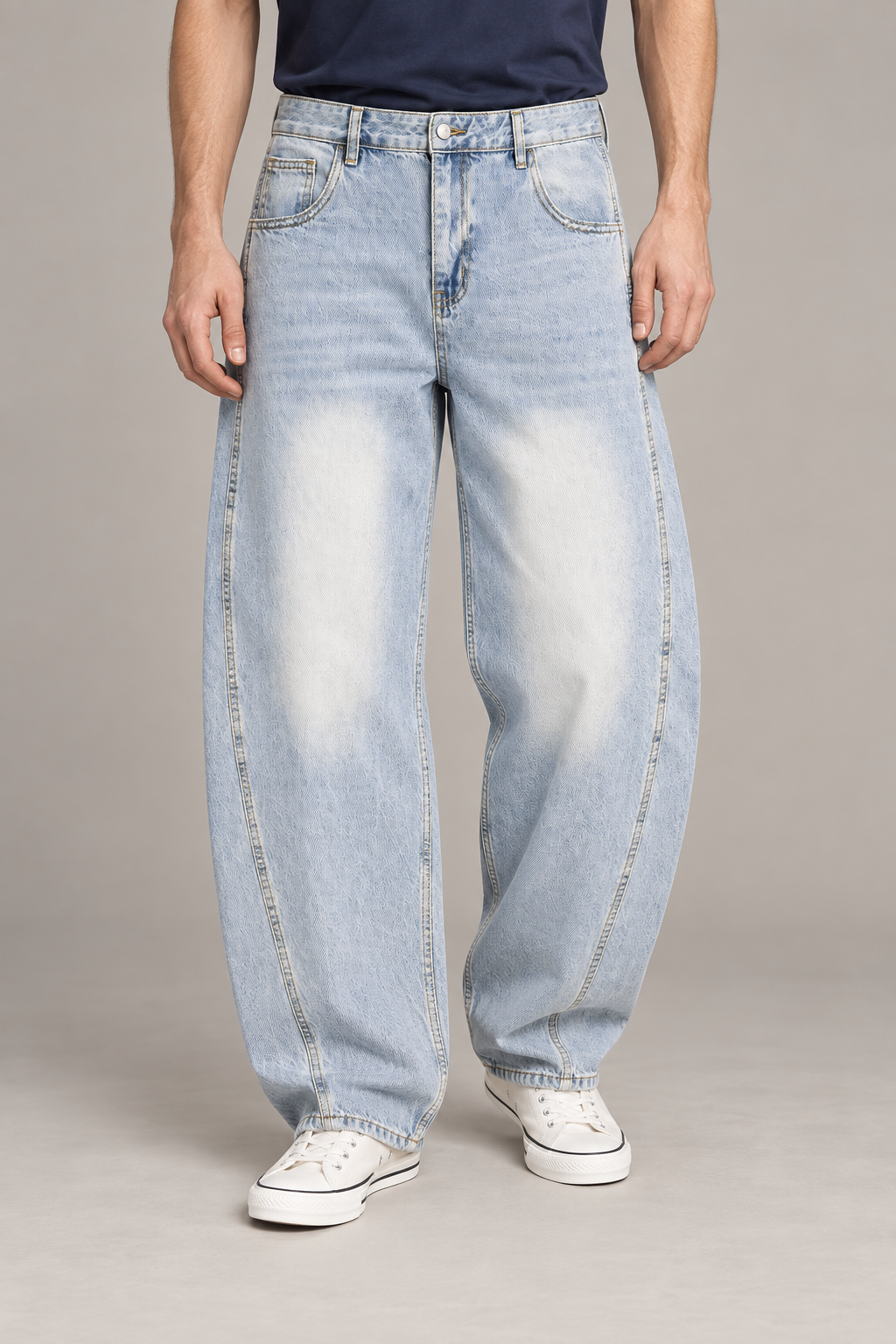 Front studio view of Pale Orbit Barrel Jeans in Light Blue, showing sunfaded thighs and curved leg seams.