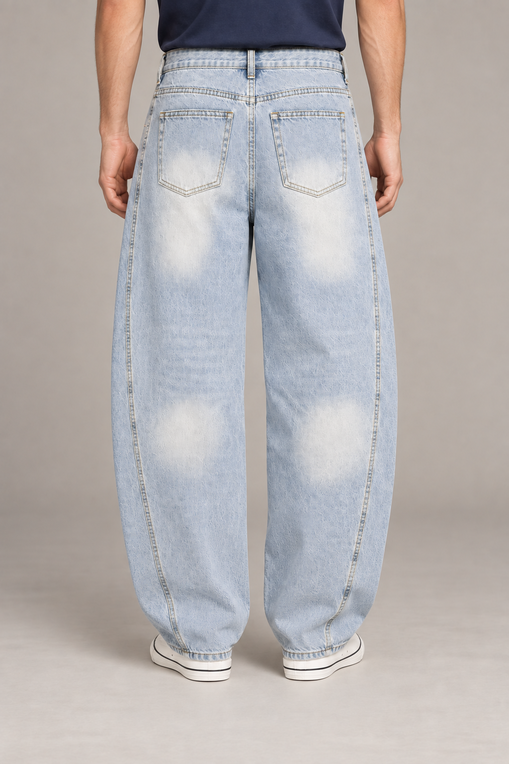 Rear studio view of Pale Orbit Barrel Jeans in Light Blue, showing faded patch pockets and the barrel silhouette.