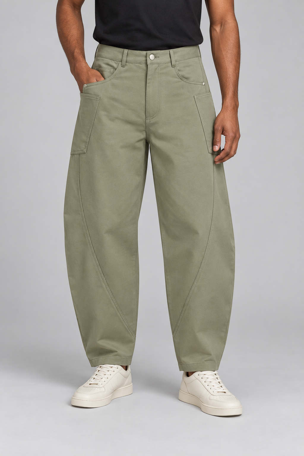 Front studio view of Field Arc Barrel Pants in Gray Green, showing curved seams and large side patch pockets.