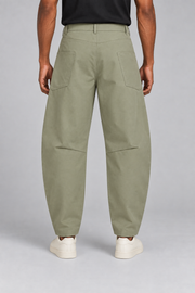 Rear studio view of Field Arc Barrel Pants in Gray Green, showing side pocket placement and knee shaping darts.