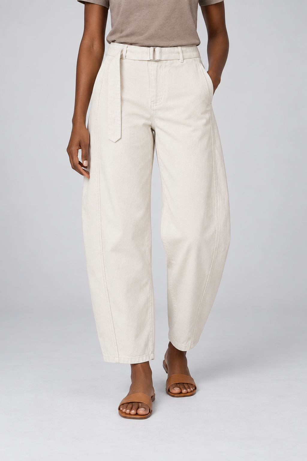 Front studio view of Soft Arc Belted Chinos in White, showing the matching belt and curved leg seams.
