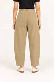 Rear studio view of Soft Arc Belted Chinos in Khaki, showing two plain patch pockets and a loose silhouette.