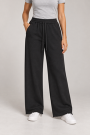 Front studio view of Soft Pause Wide Leg Sweatpants in Black, showing the long drawstrings and raw hems.