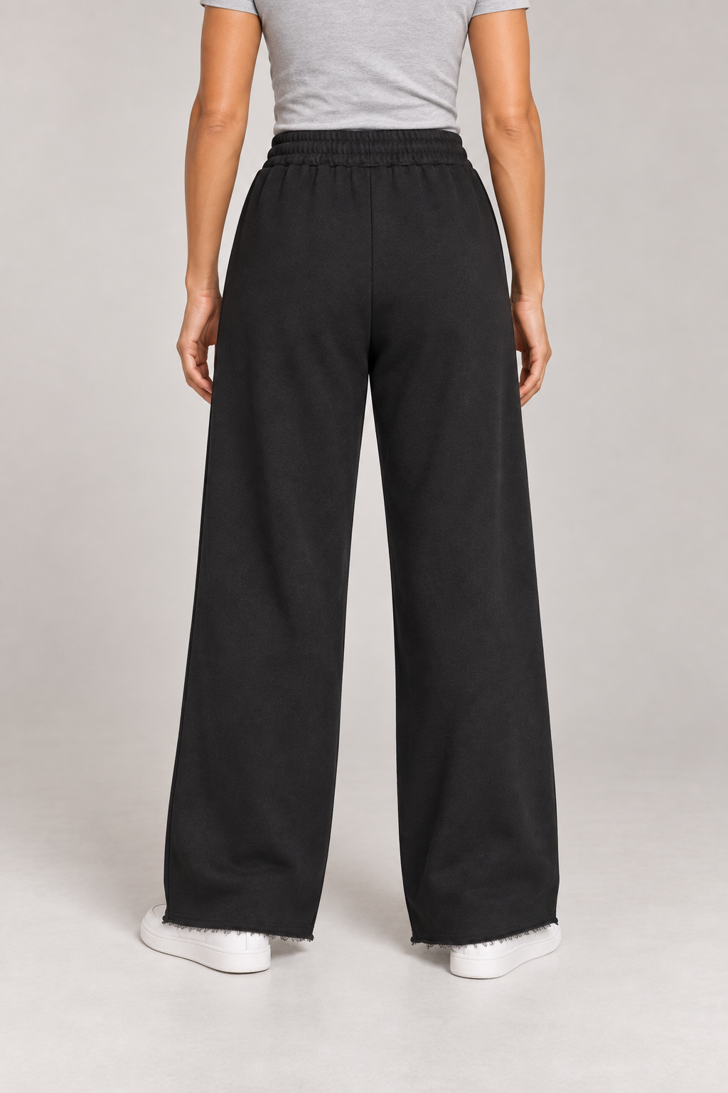 Rear studio view of Soft Pause Wide Leg Sweatpants in Black, showing the plain back and wide-leg drape.