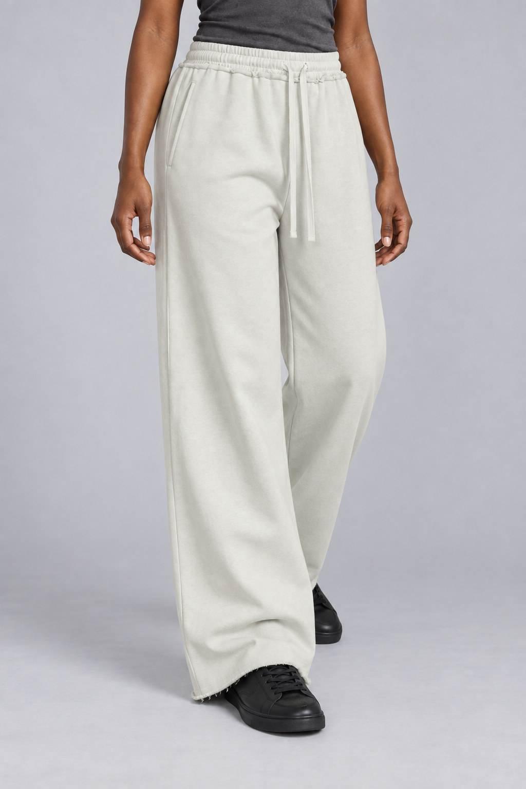 Three-quarter view of Soft Pause Wide Leg Sweatpants in White Gray, showing side pockets and the relaxed drape.