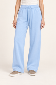 Front view of Soft Pause Wide Leg Sweatpants in Sky Blue, showing the high drawstring waist and raw hems.