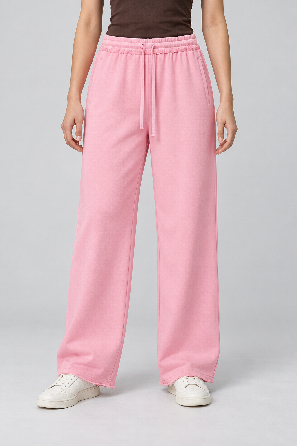 Front view of Soft Pause Wide Leg Sweatpants in Pink, showing the high drawstring waist and raw hems.