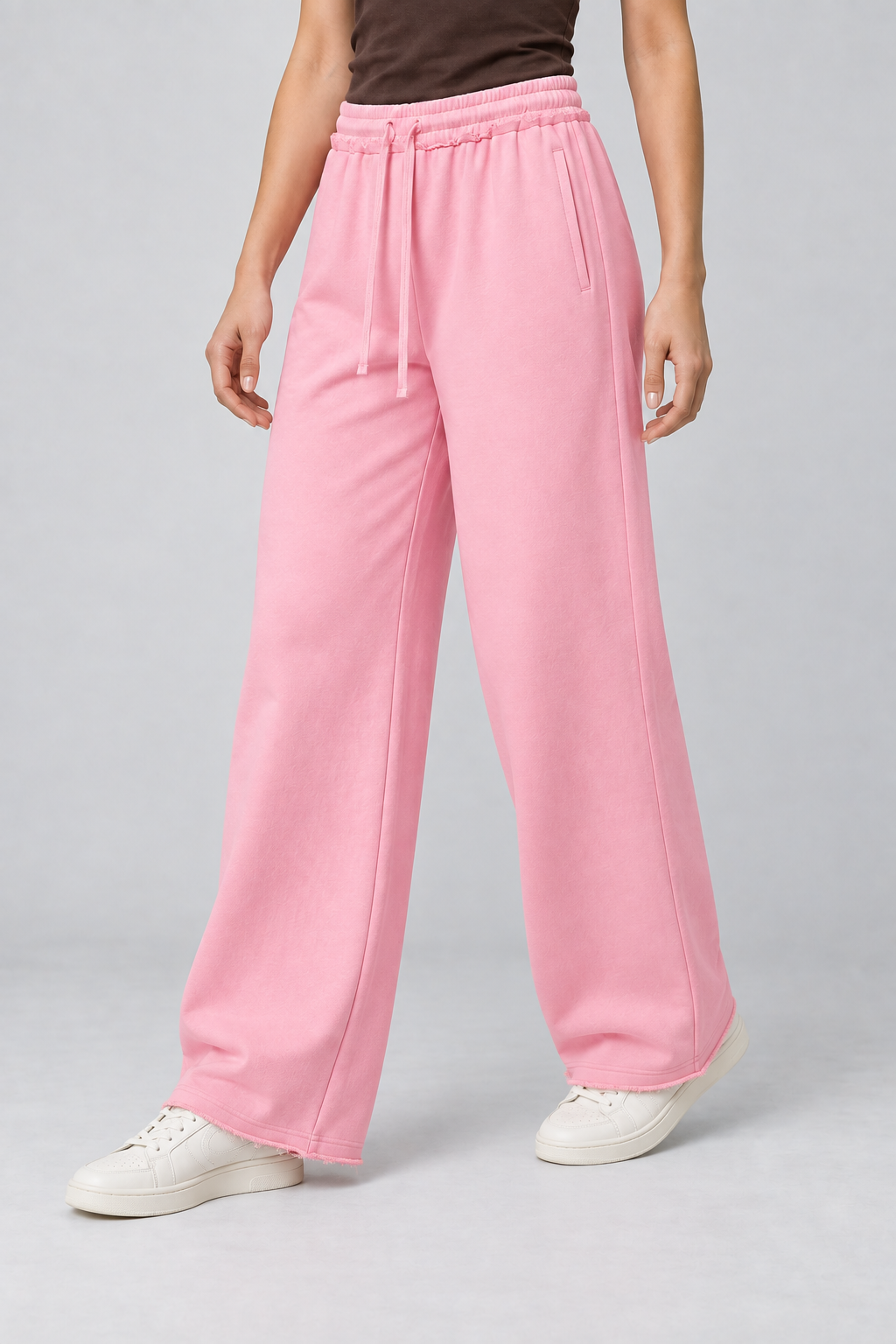 Three-quarter view of Soft Pause Wide Leg Sweatpants in Pink, showing side pockets and the relaxed drape.