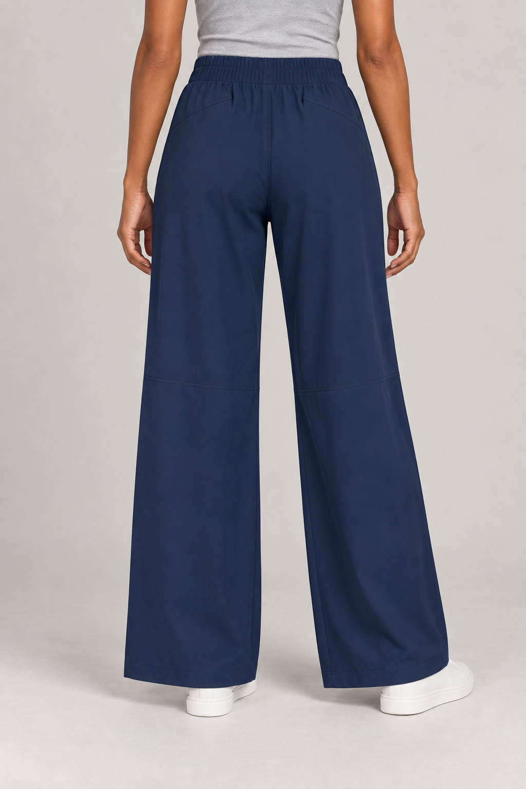 Rear view of Open Flow Wide Leg Yoga Pants in Navy Blue, showing subtle shaping seams and wide legs.