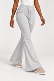 Three-quarter view of Quiet Bell Flared Sweatpants in Flower Gray, showing slash pockets and the shaped lower legs.