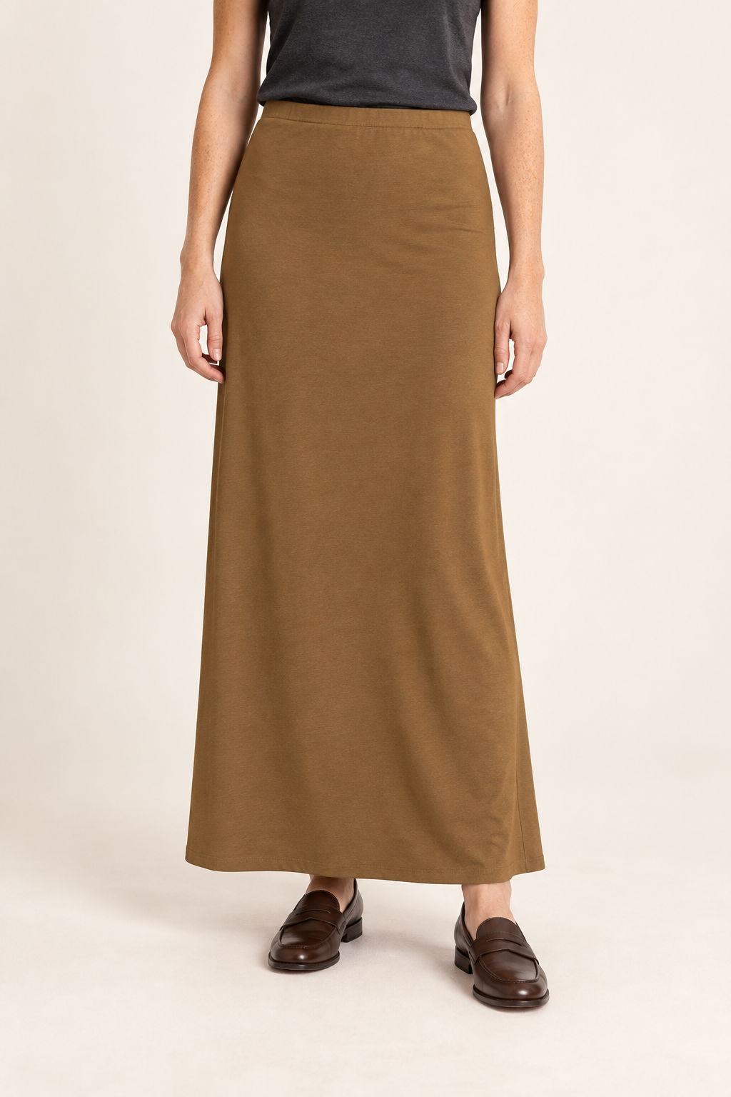 Front studio view of Quiet Column Knit Maxi Skirt in Brown, showing the plain long silhouette and simple elastic waist.
