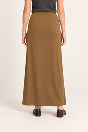 Rear studio view of Quiet Column Knit Maxi Skirt in Brown, showing the uninterrupted back and smooth knit drape.