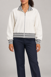 Front view of Club Tempo Rib Collar Jacket in Off White showing the striped collar, cuffs and hem with a silver zip.