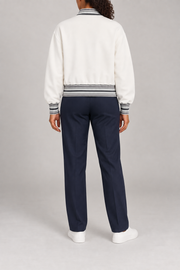 Rear view of Club Tempo Rib Collar Jacket in Off White showing the plain back and striped rib edges.
