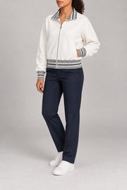 Three-quarter view of Club Tempo Rib Collar Jacket in Off White showing its boxy shape and discreet front pockets.