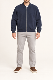 Front view of Campus Still Fleece Varsity Jacket in Navy showing tonal ribbing, silver zip and welt pockets.