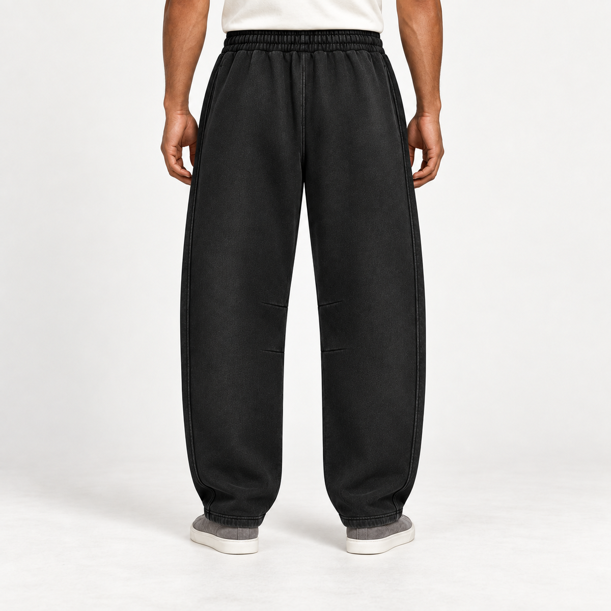 Rear view of After Hours Barrel Fleece Sweatpants in Black showing the plain back and curved leg silhouette.