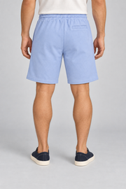 Rear view of Clear Day Cotton Shorts in Sky Blue, showing the single horizontal welt pocket and plain finish.