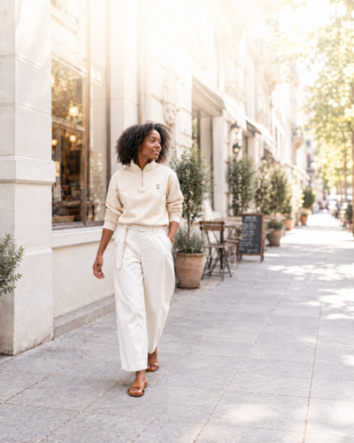 Woman in cream TELLS clothing
