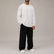Full studio look with Archive Long Sleeve in White styled with black wide leg trousers.