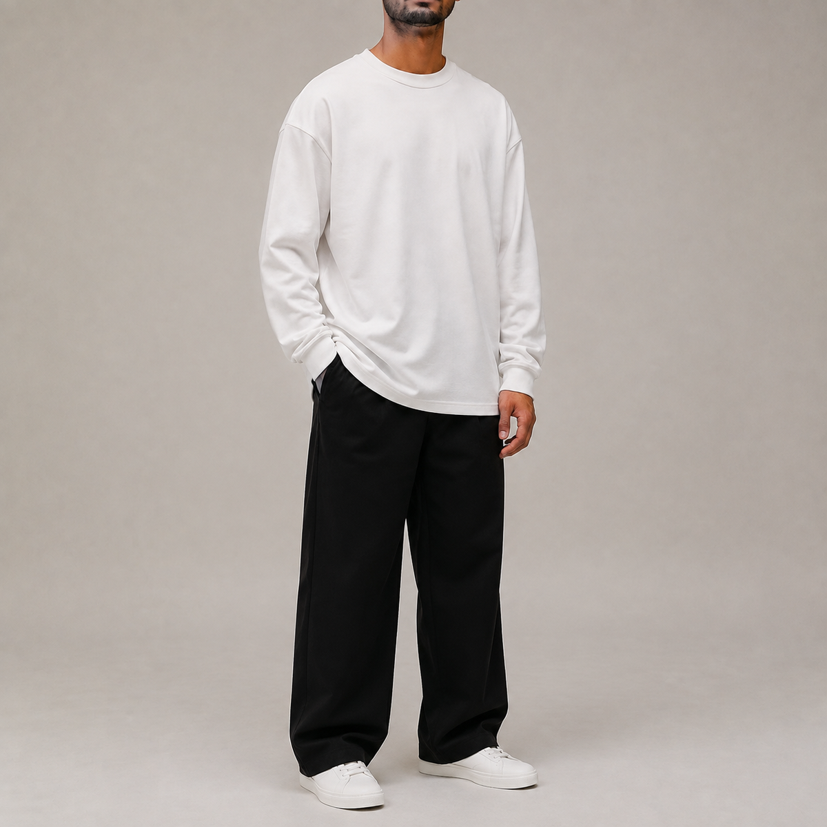 Full studio look with Archive Long Sleeve in White styled with black wide leg trousers.