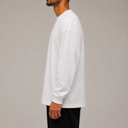 Side studio view of Archive Long Sleeve in White highlighting sleeve length and relaxed drape.
